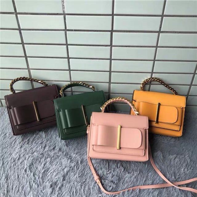 charles & keith chunky metal top handle bow flap bag