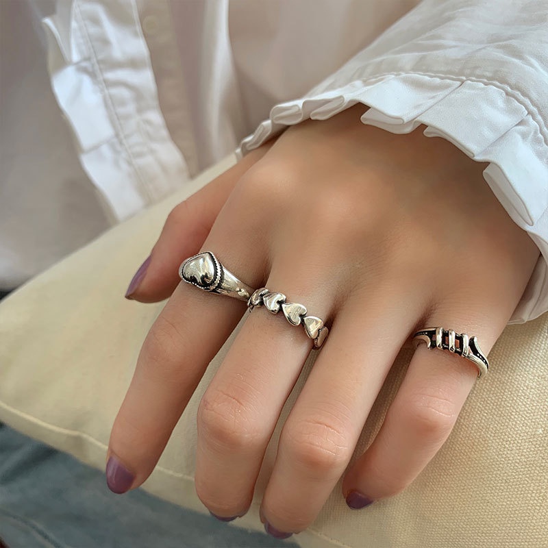 Set 7 nhẫn AY trang trí trái tim chữ thập màu đen thời trang dành cho nữ