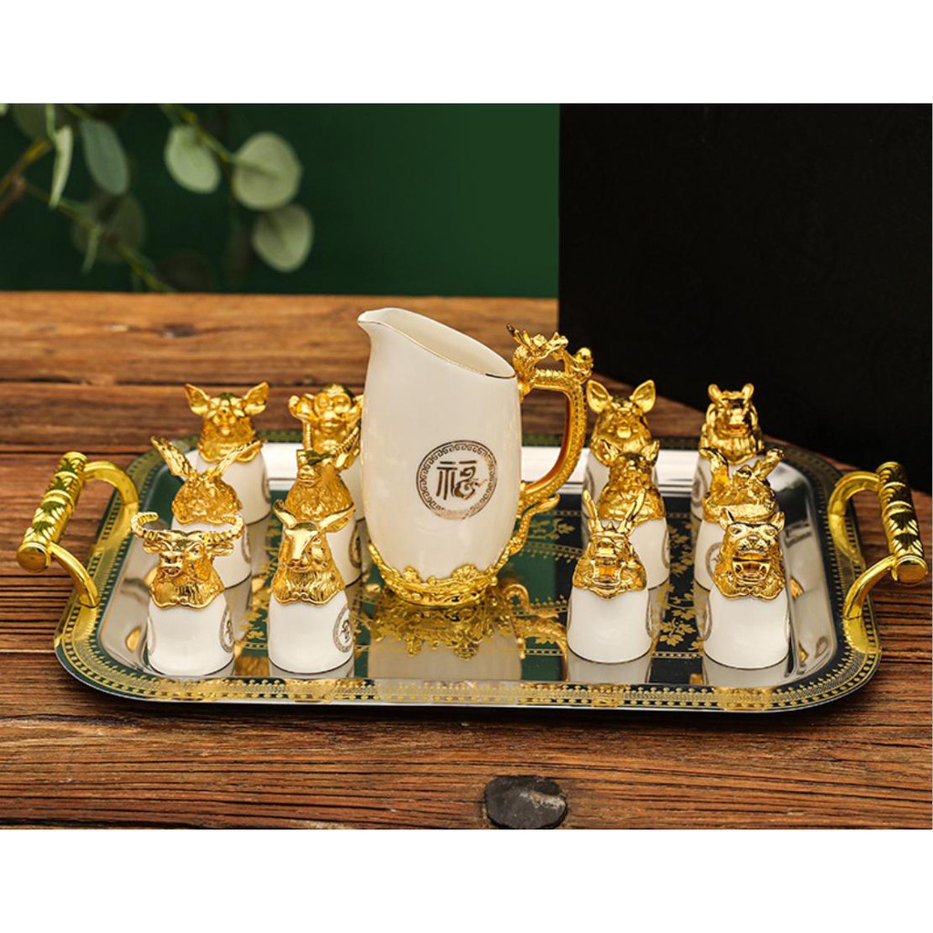 Bộ ly 12 con giáp sứ trắng mạ vàng sang trọng (hộp da)