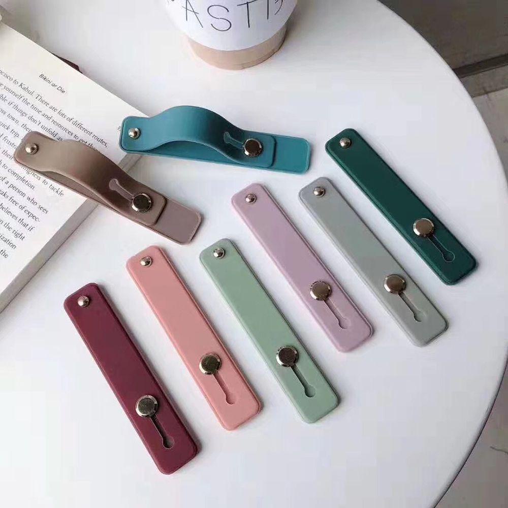 Giá Đỡ Điện Thoại Bằng Silicon Màu Kẹo Ngọt Có Dây Đeo Tay Tiện Dụng