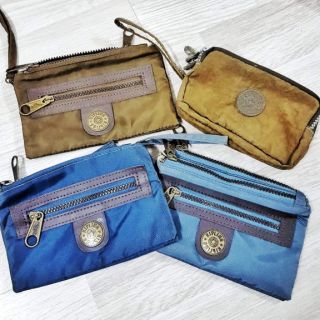 Ví tiền mini KIPLING cầm tay dây kéo vải dù màu nâu