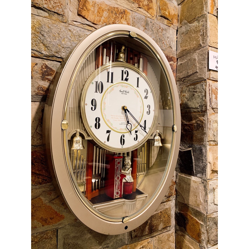 Đồng hồ treo tường Small World phiên bản cô gái đánh đàn màu ghi xám Nhật Bản MS864
