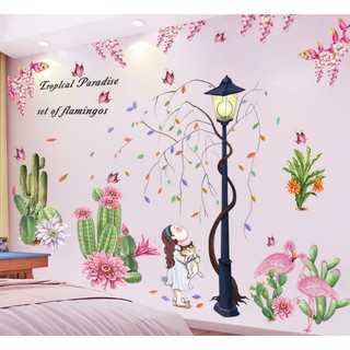 Decal dán tường Bé ôm mèo trong khu vườn