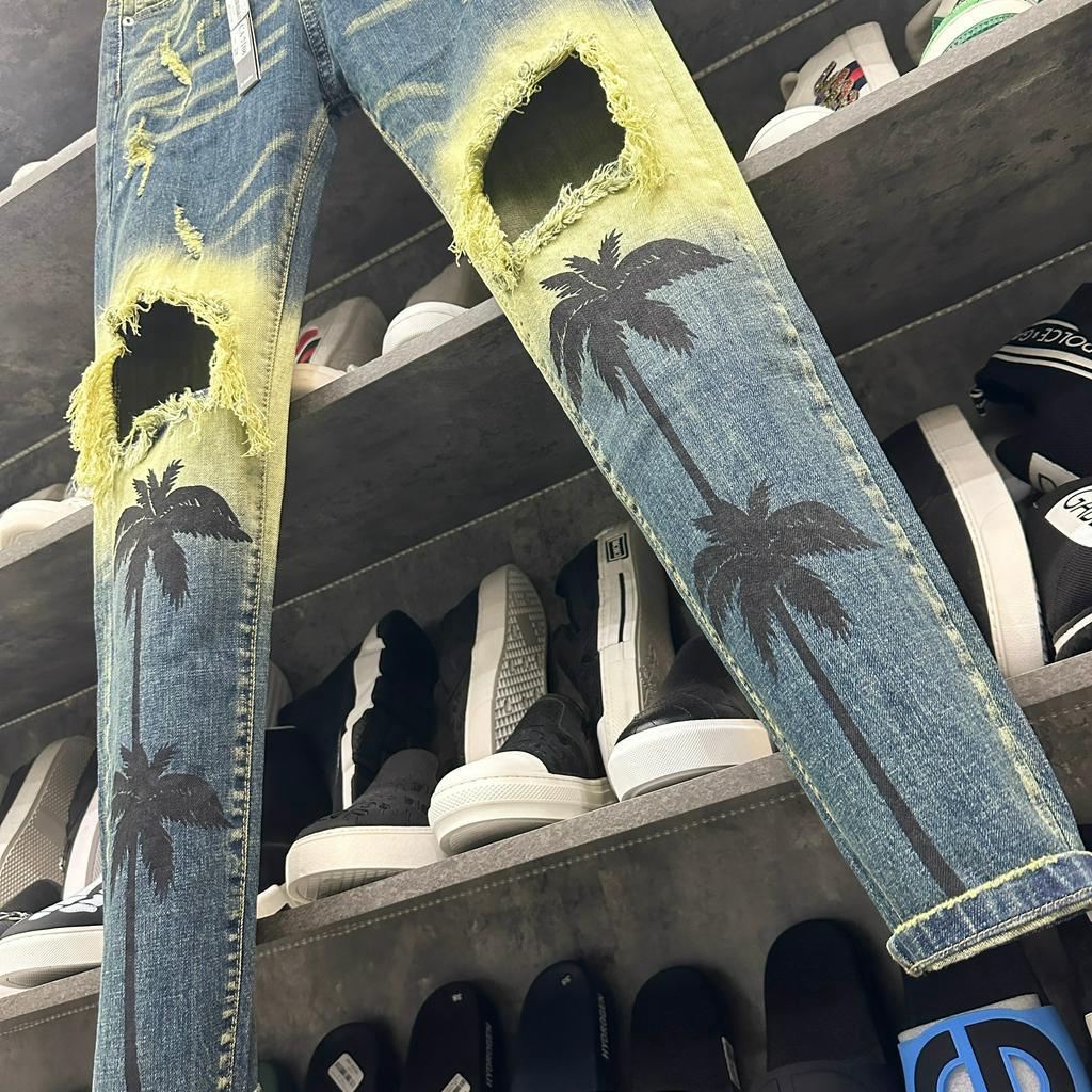 Quần jean bò nam Amiri skinny wash xanh vàng thủng gối tua viền dập hình cây dừa phong cách boy phố QJ227P