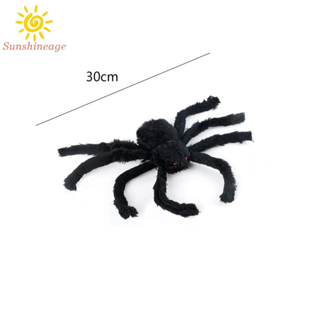 Halloween giant spiders hang in haunted homes, decorated with black fake spiders, cunning toys and Halloween gifts