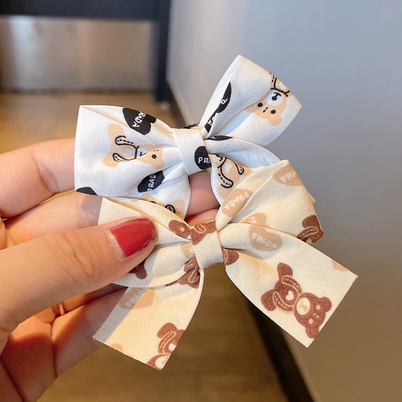 Kẹp tóc hình nơ màu đỏ sữa cà phê xinh xắn cho bé gái