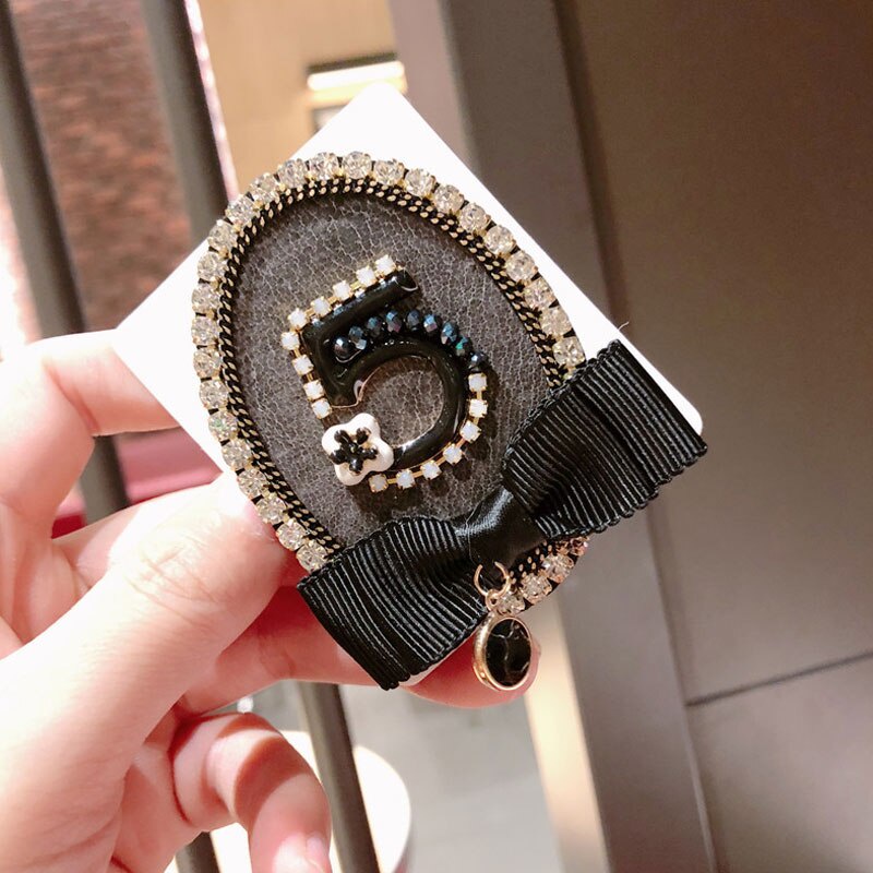 Ghim cài áo hình nơ đính ngọc trai giả sang trọng