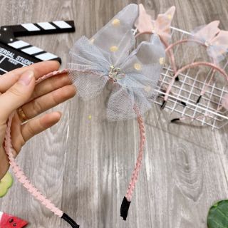 Bờm nơ lệch cho bé gái