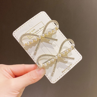 Kẹp tóc hình nơ đính ngọc trai