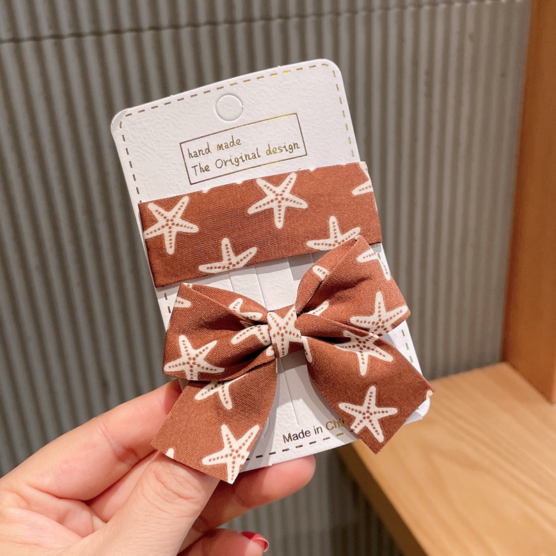 Kẹp tóc bb dáng vuông và nơ buộc làm từ vải họa tiết sao biển bắt mắt