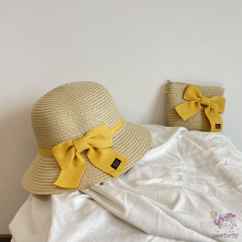 Set mũ vành và túi xách đan cói đính nơ thời trang mùa hè đáng yêu cho bé gái