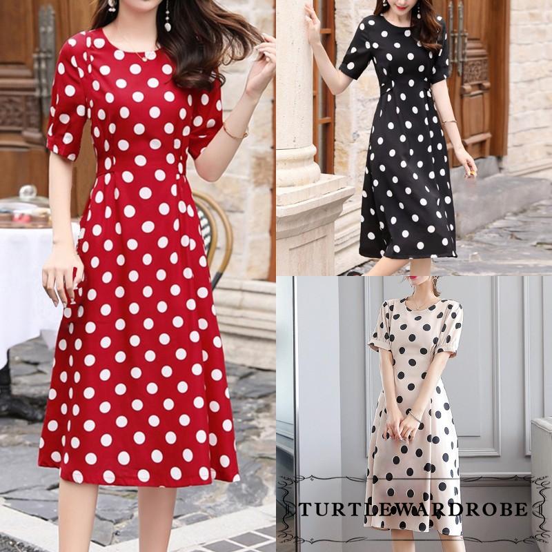 Jumpsuit Tay Ngắn Cổ Tròn Hoạ Tiết Chấm Bi Phối Nơ Cho Nữ