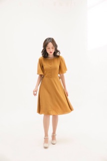 Đầm vàng nghệ nơ eo