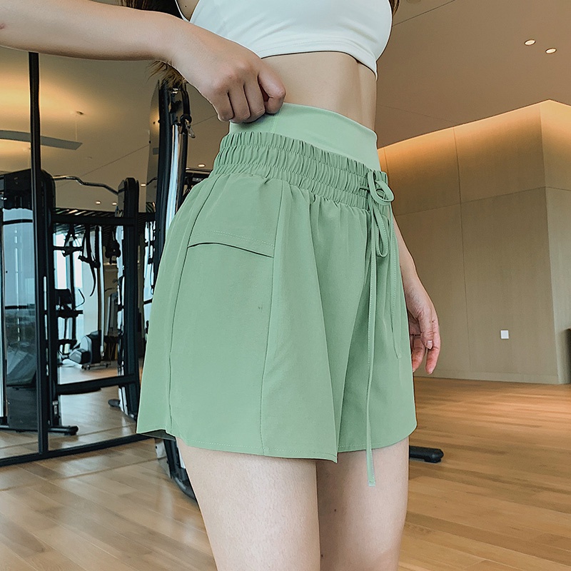 Quần short thể thao lưng cao có túi phong cách năng động thời trang cho nữ