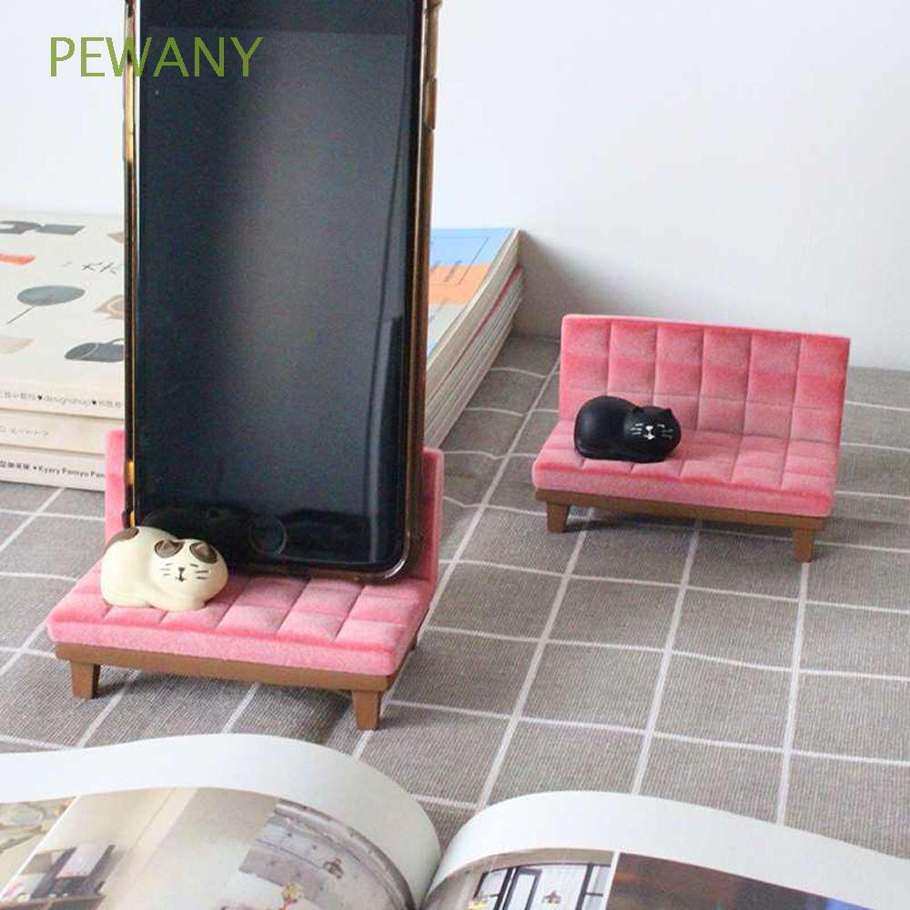 Giá đỡ điện thoại bằng nhựa resin hình chú mèo ngồi trên sofa dễ thương