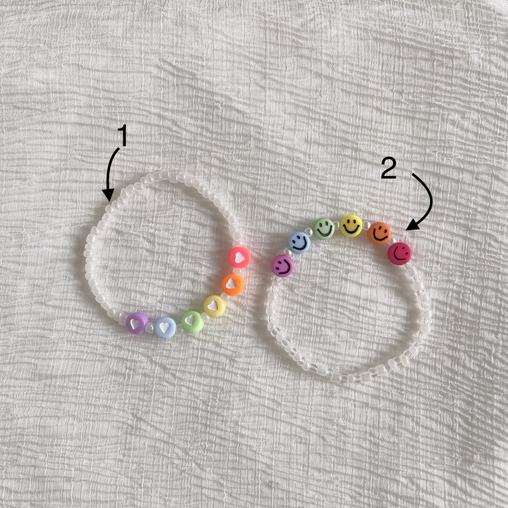 Vòng tay handmade trắng pastel mix hạt charm