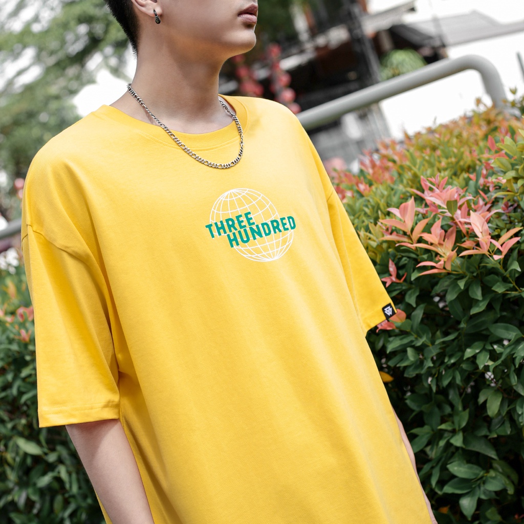 Áo Thun Vàng In Chữ The World Gorgeous Màu Xanh Chất Liệu 100% Cotton Form Rộng Thoải Mái Unisex Nam Nữ