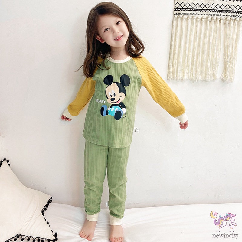 Bộ trang phục gồm áo và quần bó sát lưng cao họa tiết hoạt hình màu tươi sáng kiểu dáng Hàn Quốc thoải mái cho bé gái