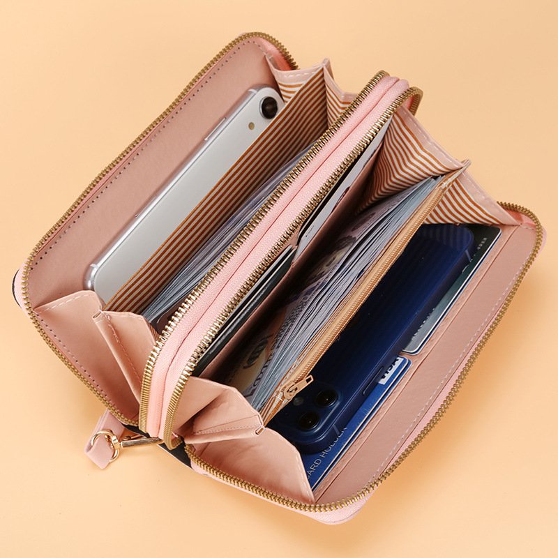 Ví nữ dài cầm tay mẫu mới, với 2 khoá kéo kiểu dáng sang trọng NEW-0057 được phối kim tuyến và kẻ sọc màu chéo đẳng cấp