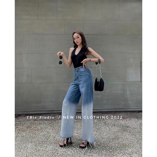 Quần jeans loang rách