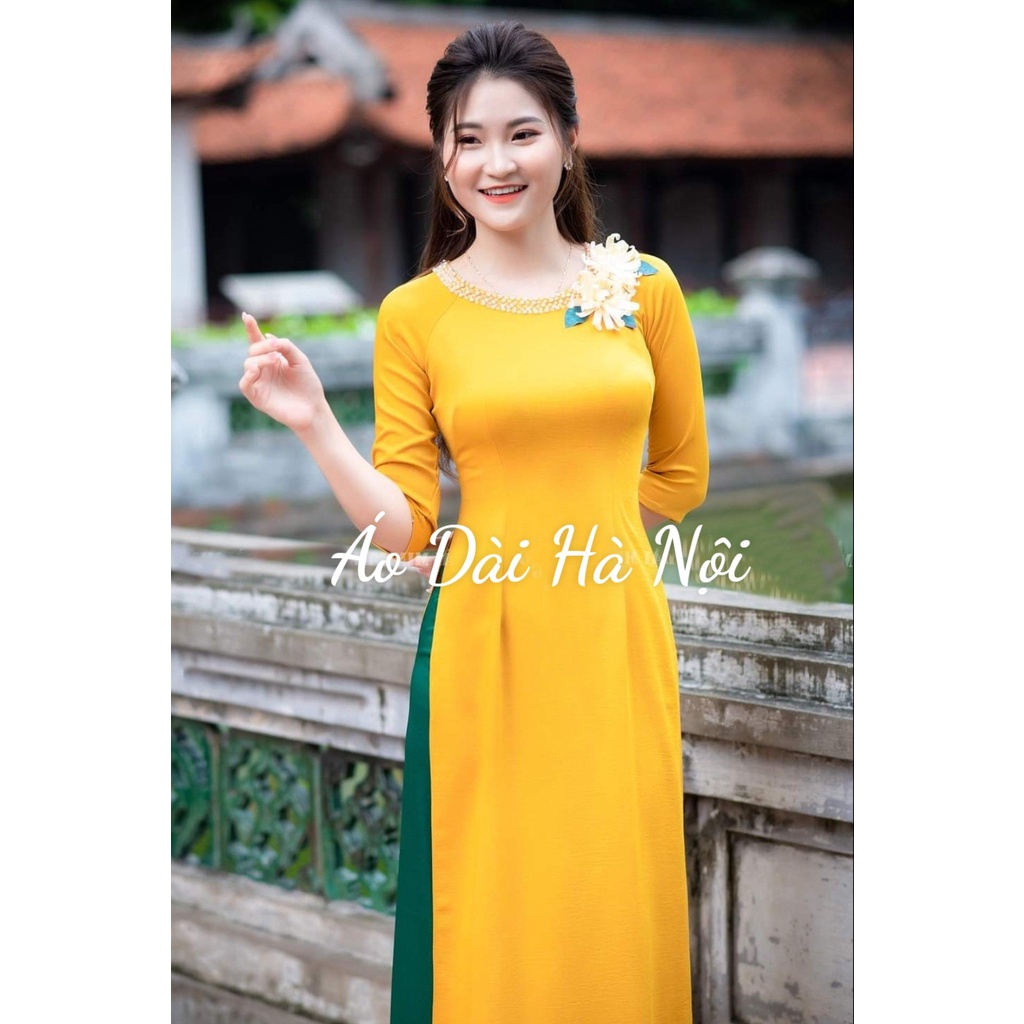 Áo dài màu vàng kết hoa đính ngọc, vải lụa mỹ mềm mịn co giãn tốt - Áo Dài Hà Nội