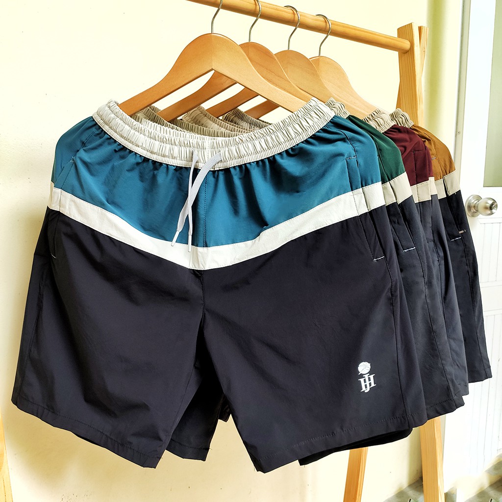 Quần đùi nam, quần short nam vải gió chun co giãn mềm mại thoải mái, thiết kế phối màu ấn tượng.
