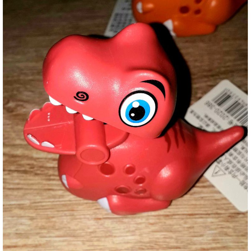 Một chiếc xe khủng long siêu dễ thương chạy chớn bằng nhựa rất đẹp