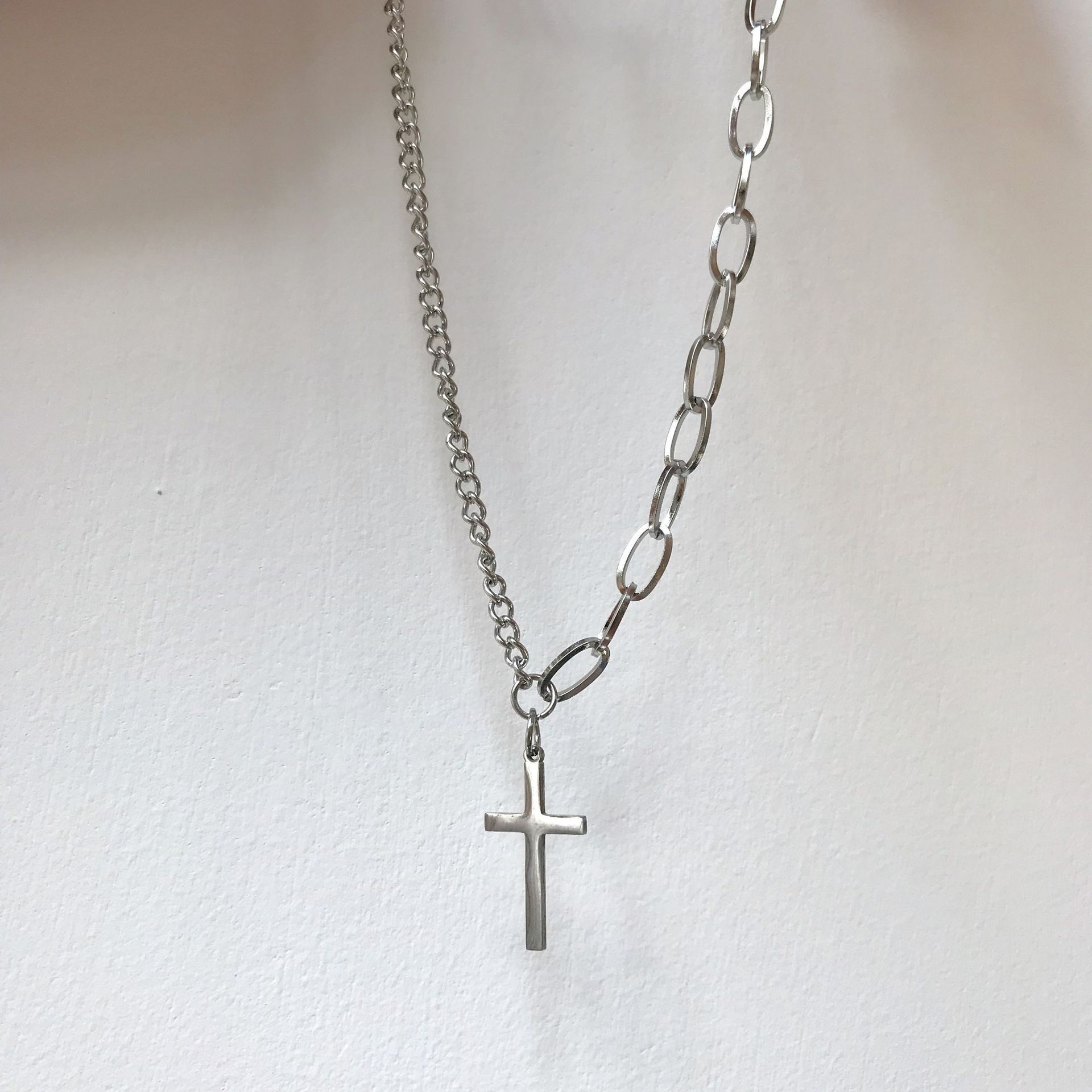  Asymmetrical necklace with cross pendant