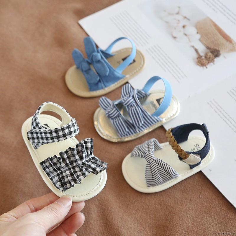 Sandal đính nơ đế mềm chống trượt kiểu dáng thời trang cho bé