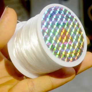 cuộn dây chỉ tơ xỏ chuỗi