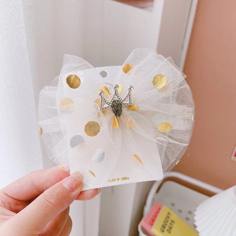 Kẹp tóc nơ tone vàng xinh xắn cho bé