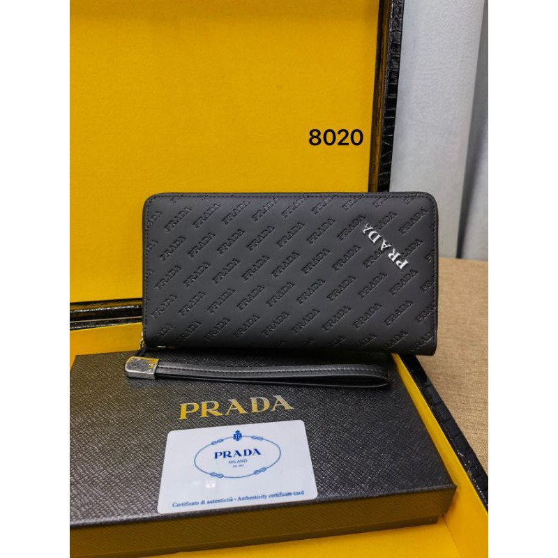 ví cầm tay nam da thật dáng dài kéo khóa có quai cầm tay dập logo chữ Prada
