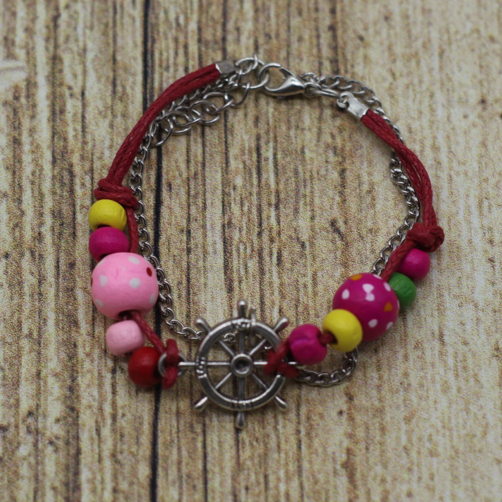 VT49 Vòng tay hạt gỗ mix charm 5 cái/lốc