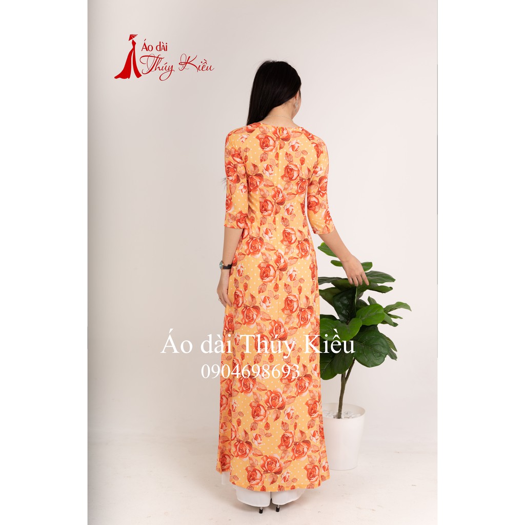 Áo dài Thúy Kiều in 3D lụa Nhật vàng cam hoa hồng K21