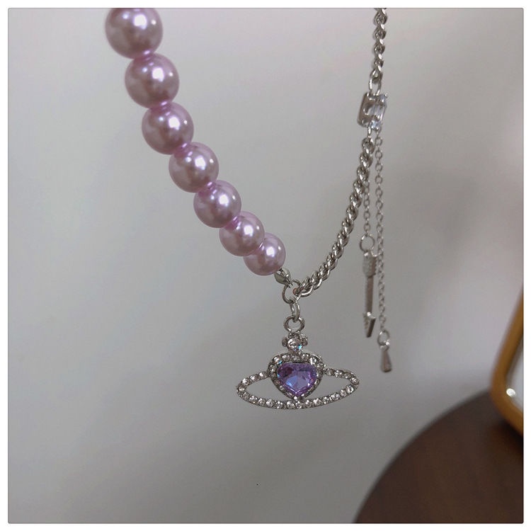 Vòng cổ mặt hình hành tinh trái tim phối ngọc trai giả màu tím 191210