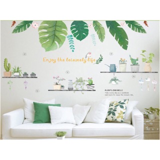 Decal dán tường tán lá cây kết hợp chậu cây