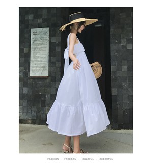Đầm trắng 2 dây nơ lưng phù hợp đi chơi và đi du lịch