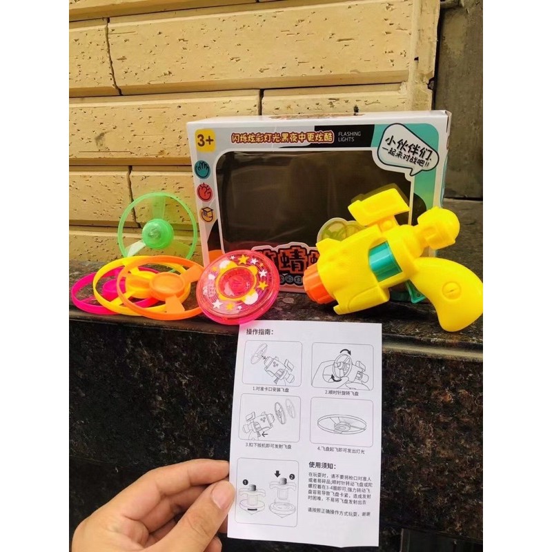 Súng con quay vặn cót mẫu mới cho bé