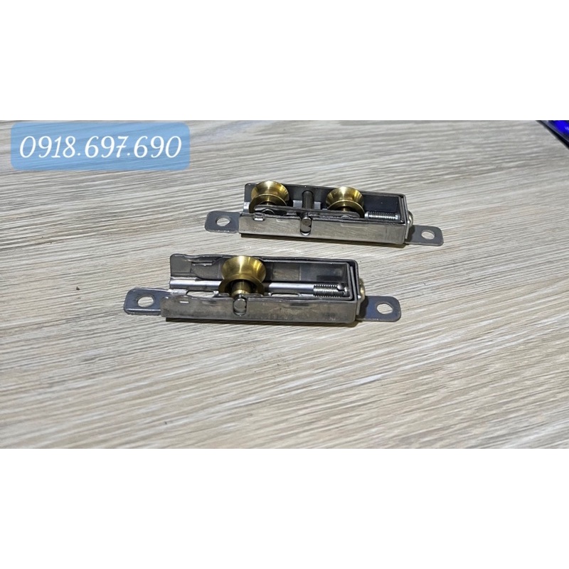 Bánh xe Inox đồng cửa lùa hệ 55 nhôm xingfa không cần dập lỗ