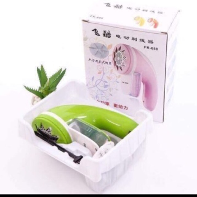 Máy cắt lông sũ và hút bụi quần áo