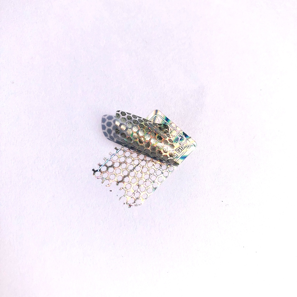 Tem niêm phong chống giả hologram 1.5 x 2.5cm tổ ong combo 1.000c