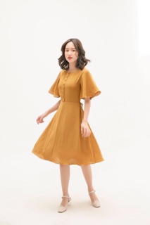 Đầm vàng nghệ nơ eo