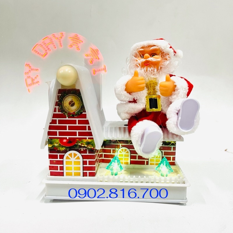 Đồ chơi ông già noel ngồi mái nhà xoay nhạc đèn quà tặng noel giáng sinh cho bé