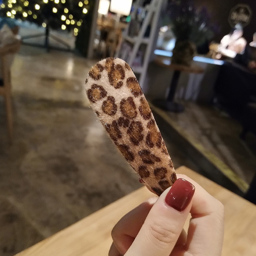 Kẹp tóc hình lông vũ thời trang