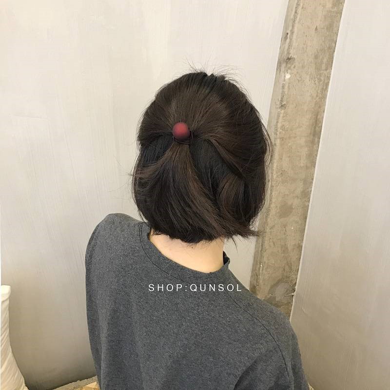 buộc tóc gắn quả cầu