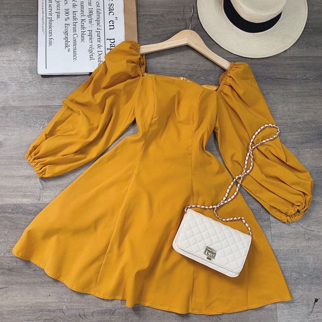 Đầm trắng tay bồng