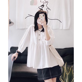áo baby doll trắng tay lửng,có 3 nút bọc caro trắng đen