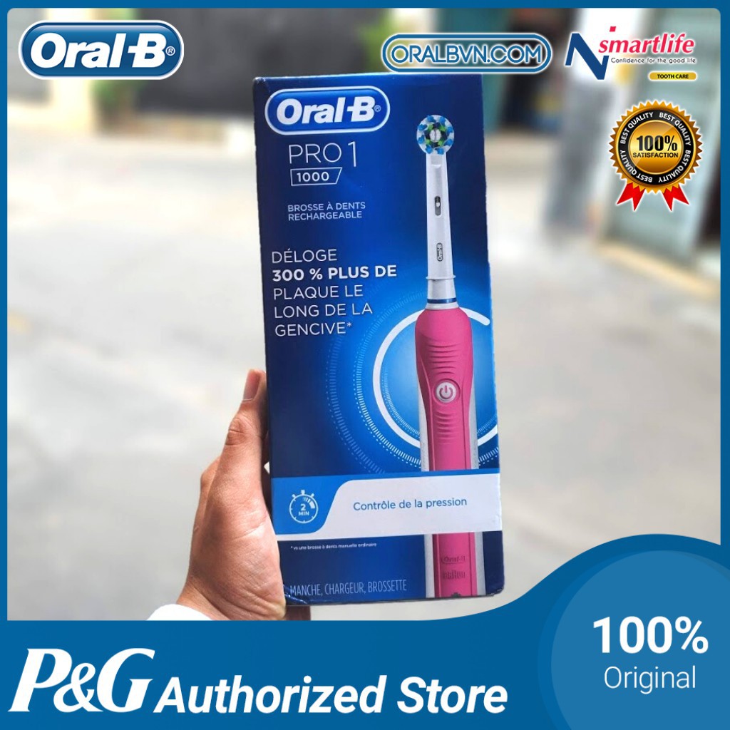 Bàn chải đánh răng điện tự động Oral B Pro 1000 màu hồng làm sạch răng, hạn chế viêm nướu kèm hộp và nắp đậy du lịch