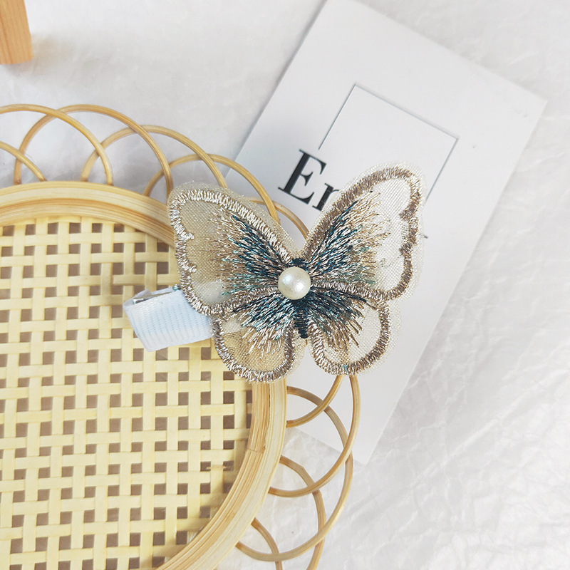 Kẹp tóc hình bướm đính hạt ngọc trai thời trang