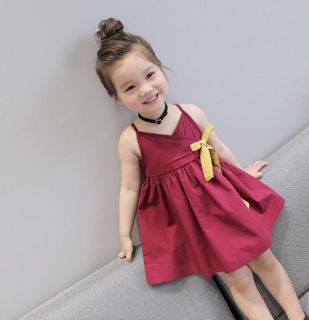 Đầm thoi 2 dây đính nơ vàng